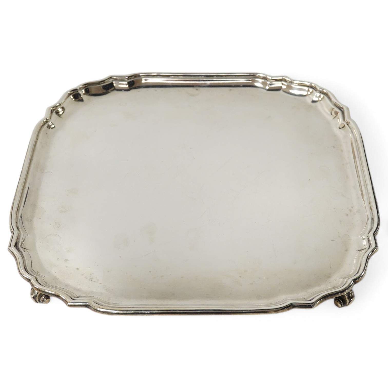 A modern shaped square silver salver, London, 1961, by C. J. Vander, 30.8cm, 320z. Condition -fair